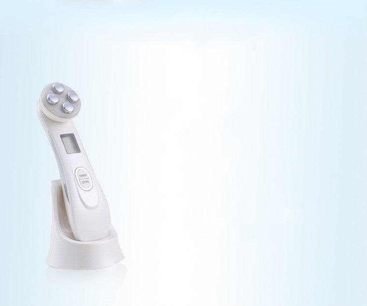 LYVA Lumi Wand in white resting on its stand