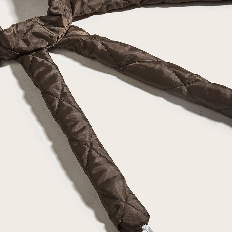 Padded satin arm close-up